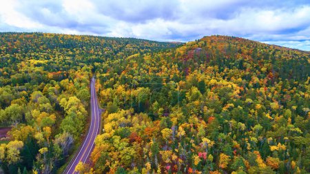 Photo for Aerial View of Scenic Autumn Drive in Copper Harbor, Michigan - Vibrant Fall Foliage Captured by DJI Phantom 4 Drone - Royalty Free Image