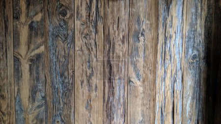 Eye-level, indoor view of rustic, aged wooden planks showcasing natural grain patterns and textures for an authentic, sustainable design theme.