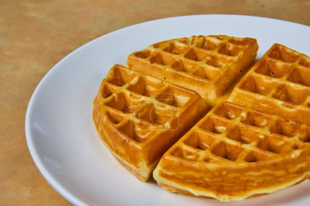 Golden Indiana Breakfast Waffles - Perfectly cooked and ready for syrup. Ideal for culinary marketing and food blogs.