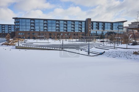 Photo for Snow-covered Promenade Park in Downtown Fort Wayne, Indiana showcasing serene winter cityscape with modern architecture. - Royalty Free Image