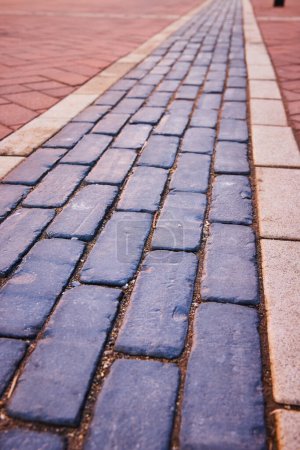 Electric Works timeless cobblestone path, a serene blend of tradition and urbanity in Fort Wayne, Indiana.