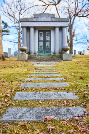 Pathway to the Past: Serene view of the Griffin Mausoleum at Lindenwood Cemetery, Fort Wayne, Indiana, capturing themes of heritage, peace, and times passage.