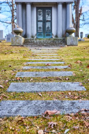 Somber and serene view of weathered stone steps leading to a historic mausoleum at Lindenwood Cemetery, Fort Wayne, embodying timeless tranquility.