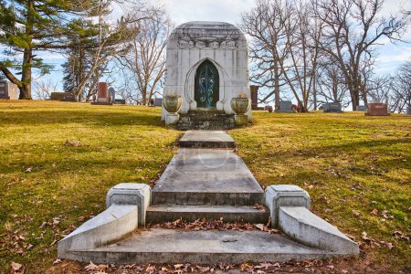 Elegant mausoleum atop a serene hill in Lindenwood Cemetery, Fort Wayne, Indiana, reflecting history and remembrance.