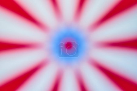 Vibrant abstract image depicting dynamic radial blur in patriotic colors, perfect for themes of energy, movement, and national pride.