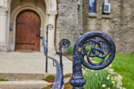 Vintage Wrought Iron Fence at Historic Bishop Simon Brute College, Embodying Timeless Architecture amidst Spring Bloom