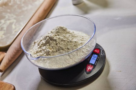 Precise Measurement of Flour for Homemade Pasta Preparation in a Fort Wayne Kitchen