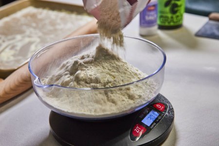 Precision in homemade pasta preparation with flour measured on a digital scale, in a cozy Fort Wayne kitchen.