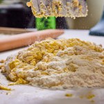 Home cooking in Fort Wayne, Indiana - hand mixing flour and egg for homemade pasta, capturing the joy of culinary arts.