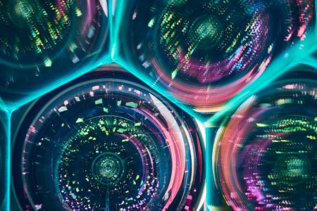 Vibrant kaleidoscopic patterns refracting through cylindrical glass lenses, creating an abstract art form in Fort Wayne, Indiana