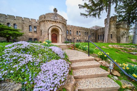Medieval castle at Bishop Simon Brute College in spring bloom, symbolizing strength and beauty in Christian education