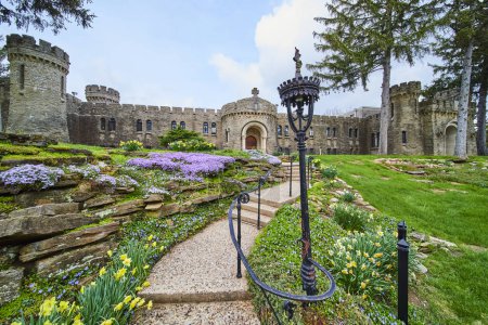 Springtime at Bishop Simon Brute College, showcasing the mix of medieval and modern architecture in a castle, amid vibrant gardens.