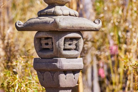 Ancient Asian stone lantern in a serene Japanese garden, symbolizing wisdom, Fort Wayne, Indiana.
