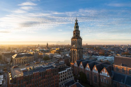 Foto de The sun setting over the historical city centre of Groningen on a beautiful afternoon. - Imagen libre de derechos