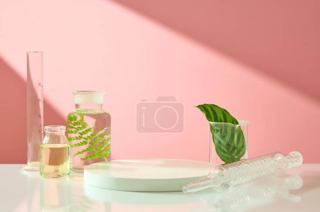 Photo for Pink background featured a podium with blank space and some glassware. Concept laboratory tests and research natural extract making cosmetics - Royalty Free Image