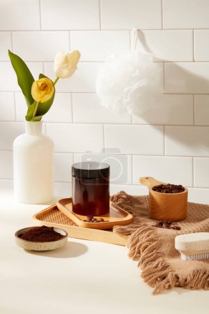 Photo for Front view of amber cosmetic jar displayed on white tile background with coffee beans and bath props. Concept for advertising organic cosmetic, product for skin care with natural ingredient - Royalty Free Image