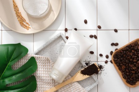 Photo for Mockup scene for advertising cosmetic for skin care with ingredient from coffee. White plastic tube with coffee beans and coffee powder on white ceramic tile background. Top view, space for design - Royalty Free Image