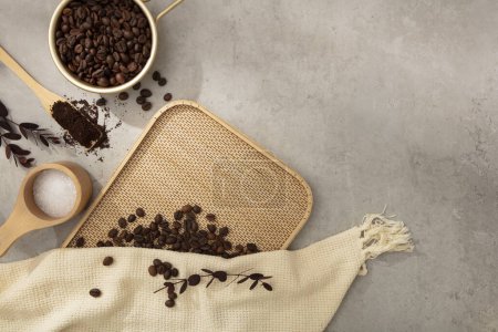 Photo for Brown roasted coffee beans decorated with beige cloth and wooden props on cement background. Space for cosmetic product mockup. Product and promotion concept for advertising - Royalty Free Image