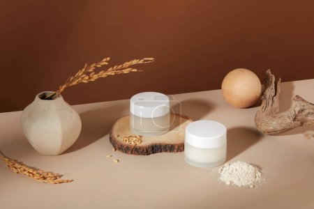 Photo for Rice bran powder showcased alongside two cosmetic jars without label. A botanical ingredient, rice bran extract is employed in cosmetics to nourish and soften the skin. - Royalty Free Image