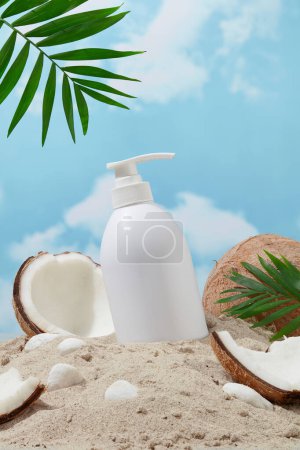 Photo for Unlabeled shower gel bottle and fresh coconut on the sand, blue sky with white clouds background. Summer vibe. Mockup for new product launch advertisement. - Royalty Free Image