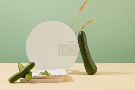 Photo for Minimalist concept with fresh cucumbers and white platforms. Copy space for branding and cosmetic advertising. Creative, front view. - Royalty Free Image