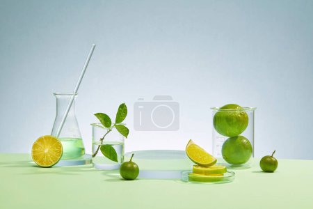 Photo for Lab equipment including a beaker, Erlenmeyer flask, glass rod, and fresh lemon set against a refreshing blue background, creating an ideal space for product display with a scientific flair. - Royalty Free Image