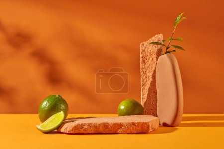 Photo for Fresh lemons, stone podiums and flower vases are placed on a yellow-orange background. The abundant amount of vitamin C in lemon helps clean the skin, remove dirt and bacteria in the most optimal way. - Royalty Free Image
