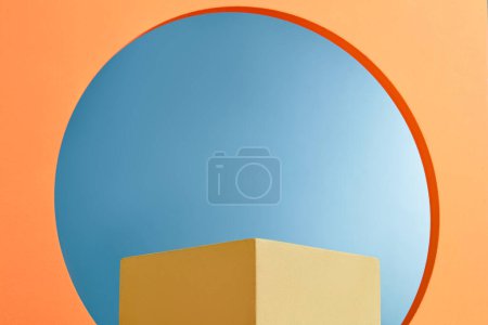 Photo for A square shaped podium in yellow color decorated against a frame with a round in the middle. Minimal scene with geometric podium platform - Royalty Free Image