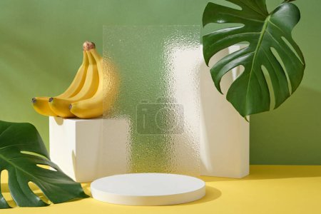 Modern composition of geometric shape podiums, transparent acrylic sheet with a banana bunch. Blank space on the podium for product promotion of Banana extract