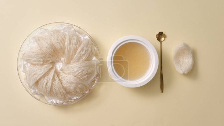 Photo for Top view of raw bird's nest neatly arranged in tray and bowl sup on beige background. Healthcare food, anti-aging, strengthen the immune system - Royalty Free Image