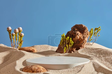 Stone podium, cosmetic display counter with natural foliage and brown stone on white sand and blue sky background. Natural background