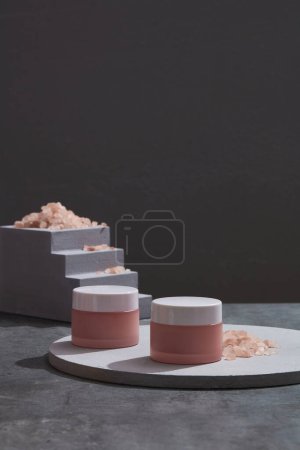 Photo for Front view of white podiums, stairway with blank space and himalaya salt on black background, unnamed product for cosmetic advertisement, space for text. - Royalty Free Image