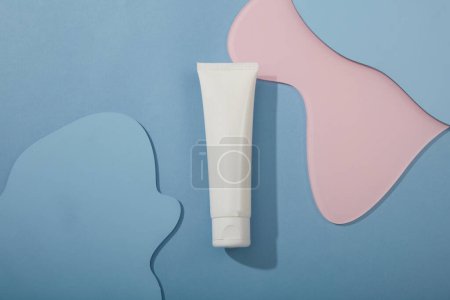 Photo for Unbranded cosmetic container isolated on geometric shape acrylic sheets background. Container packaging of skin care branding - Royalty Free Image