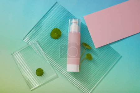 Ribbed acrylic sheet with a pump bottle in pink color placed on. Container packaging of skin care branding. Gotu kola (Centella asiatica) can reduce redness