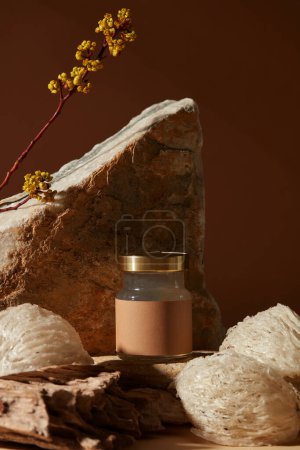 Close-up angle of transparent jar containing bird nest soup with empty label, some edible bird nests putted around. Bird nest is known as beauty food for women to have perfect skin
