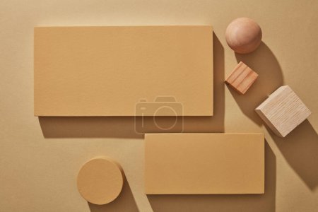 Photo for Empty mockup podium for product presentation on a minimalist brown background. Trendy design flat lay with copy space. Top view. - Royalty Free Image