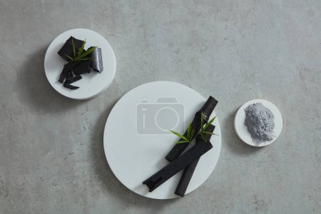 Photo for Podiums with different sizes and bamboo, powder placed on it, blank space for product promotion - Royalty Free Image