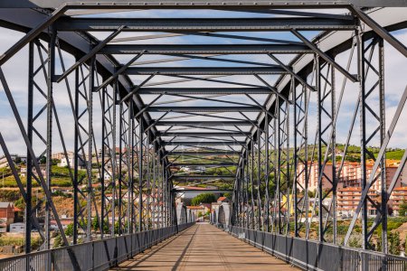 Photo for The steel bridge over the Douro River in Peso da Regua is for pedestrians only and offers beautiful views, Portugal - Royalty Free Image