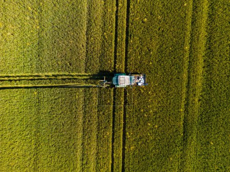 Photo for Aerial view of a tractor leaving tracks in a field, Germany - Royalty Free Image