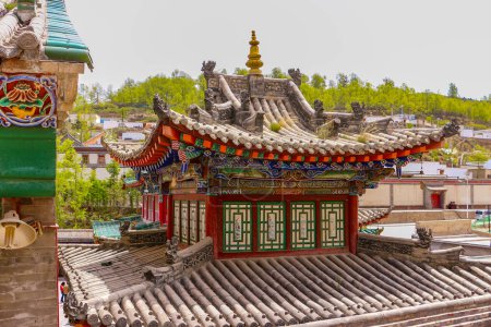 Photo for Artfully constructed roof of a pagoda on a temple in Kumbum Tibetan monastery near Xining, China, Asia - Royalty Free Image