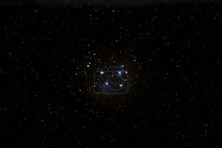 Photo for The open star cluster Pleiades M45 with the blue reflection nebula photographed with a telephoto lens near Darmstadt in February 2023 - Royalty Free Image