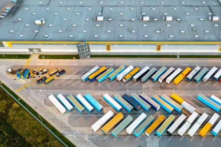 Aerial view of loading trucks in the logistics center of a large transport company