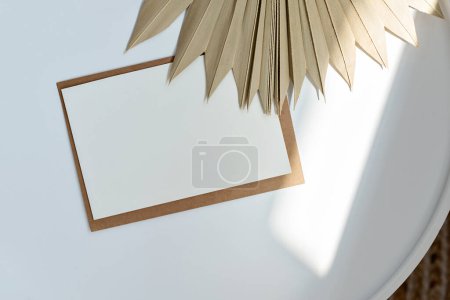 Photo for Minimalist elegant simple business brand template. Blank paper card with mockup copy space, lifestyle natural background, flat lay - Royalty Free Image