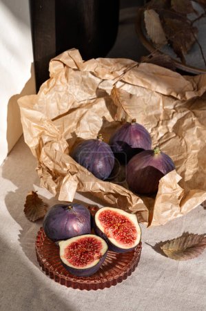 Photo for Ripe fig fruits on lifestyle messy kitchen table, aesthetic sustainable autumn still life. - Royalty Free Image