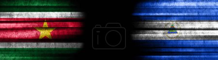 Photo for Suriname and Nicaragua Flags on Black Background - Royalty Free Image
