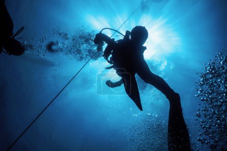 Scuba Diver at Safety Stop Underwater Bubbles, Sunlight