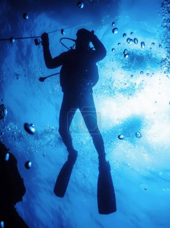 Scuba Diver at Safety Stop Underwater Bubbles, Sunlight