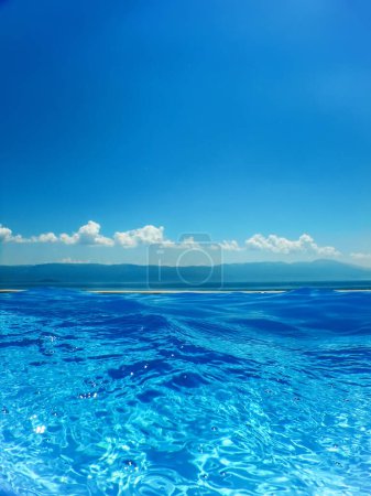 Infinity swimming pool with sea and Mountain Vie