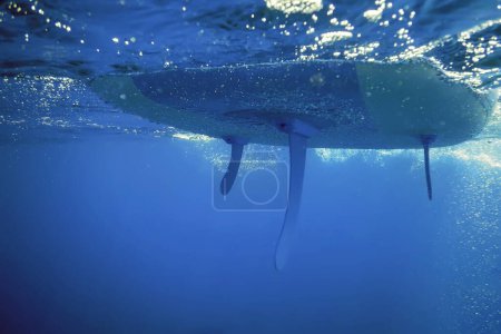 Stand up Paddle Board Underwater View with Bubbles in the Sea