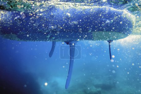 Stand up Paddle Board Underwater View with Bubbles in the Sea